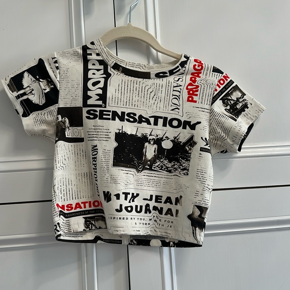 With jean newspaper cropped tee